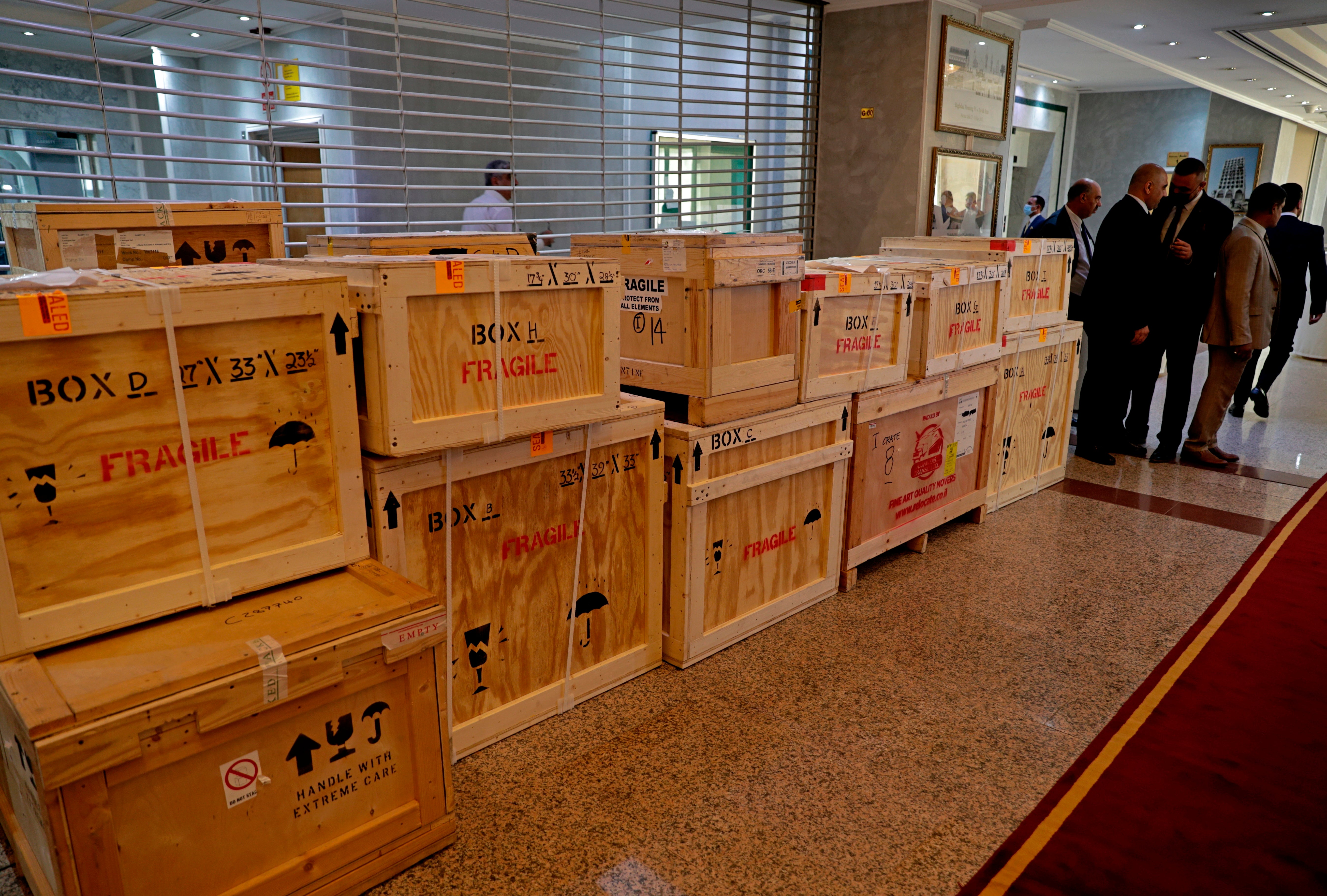 Boxes containing recovered looted artifacts sit temporarily at the foreign ministry before being transferred to the Iraq Museum, in Baghdad, Iraq,