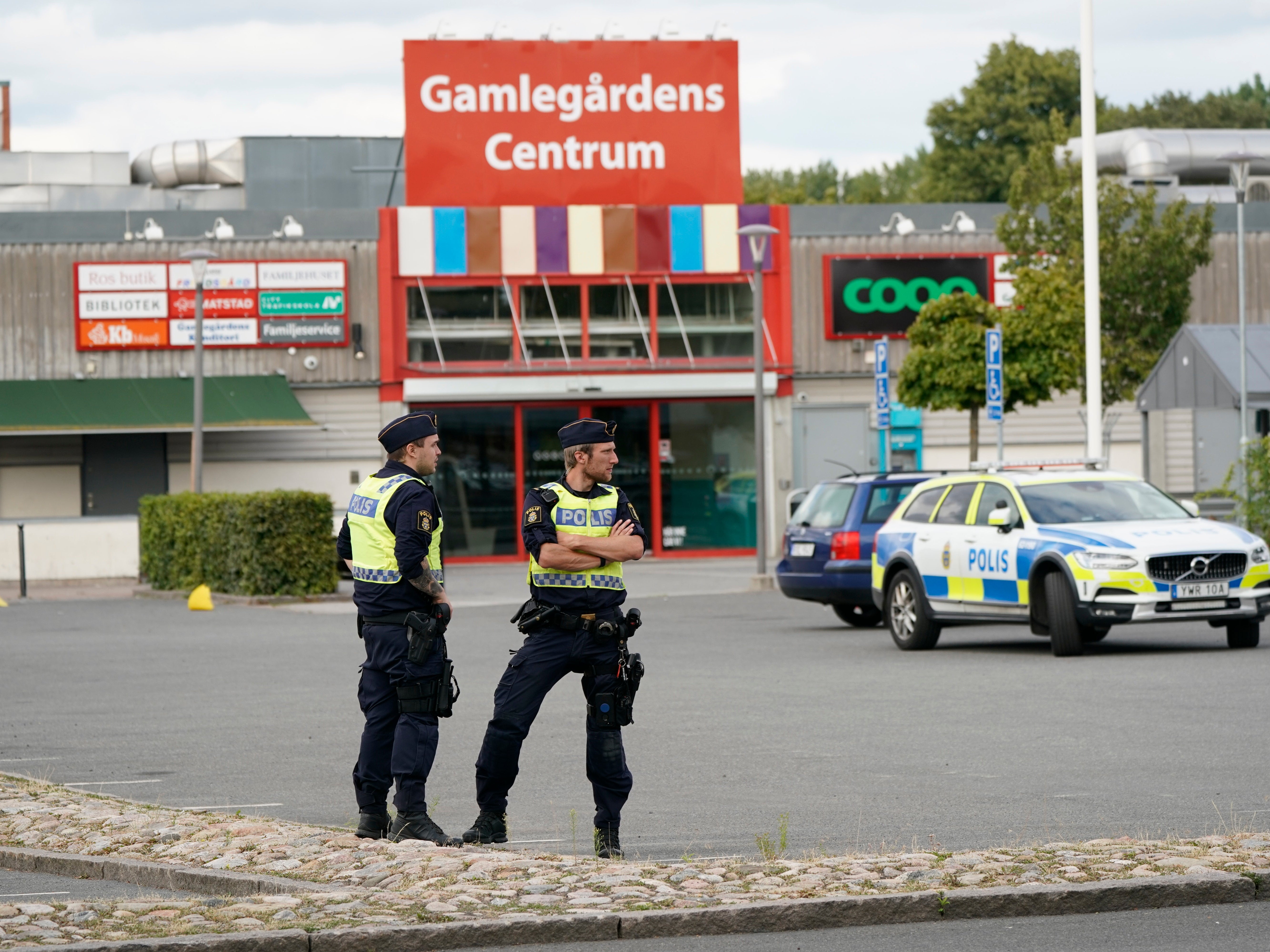 Police monitor the area at the scene of a shooting in Kristianstad