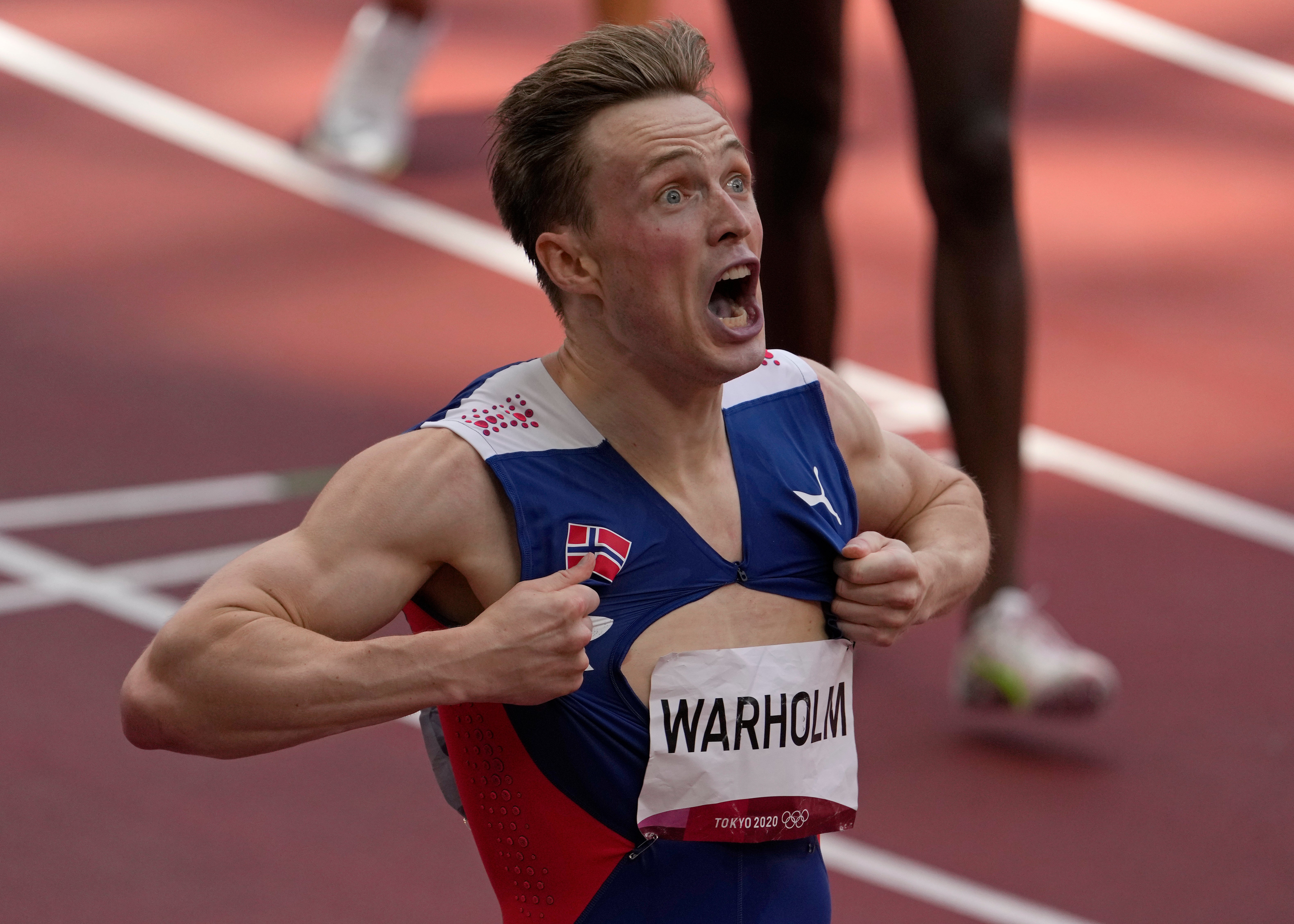 Warholm reacts after breaking the world record to win gold in Tokyo