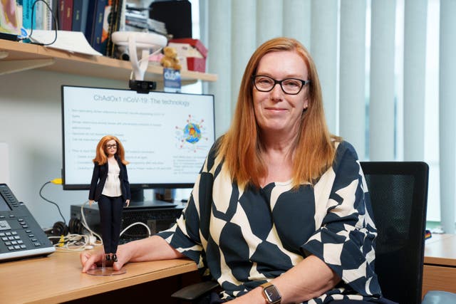<p>Professor Dame Sarah Gilbert holding a Barbie doll of herself in honour of the Oxford vaccine co-creator</p>