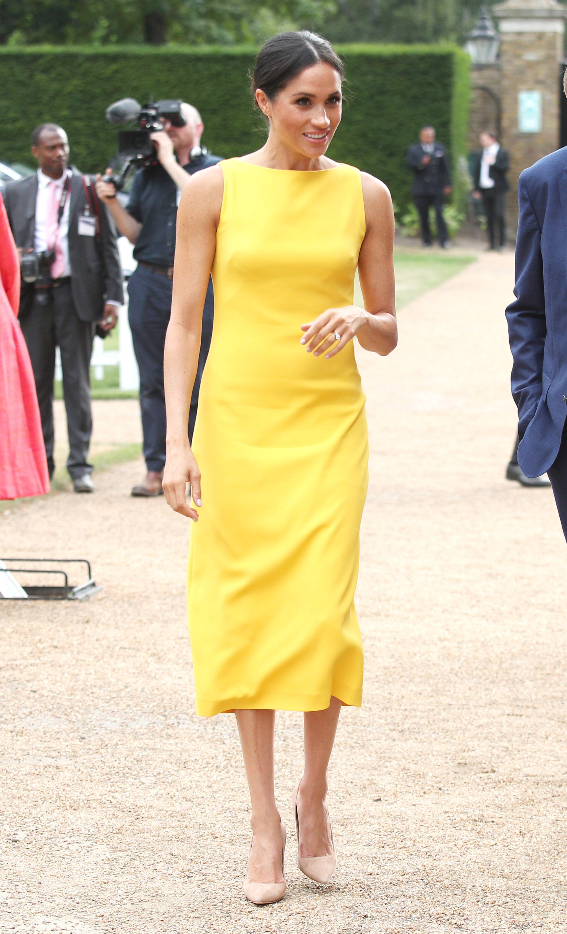 Meghan chose a vibrant yellow outfit.