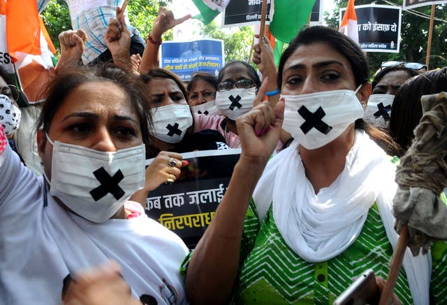 <p>Members of the Congress women’s wing protest against the alleged rape, murder and forceful cremation of a nine-year-old girl in Delhi</p>