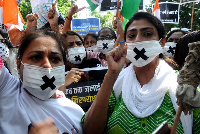<p>Members of the Congress women’s wing protest against the alleged rape, murder and forceful cremation of a nine-year-old girl in Delhi</p>