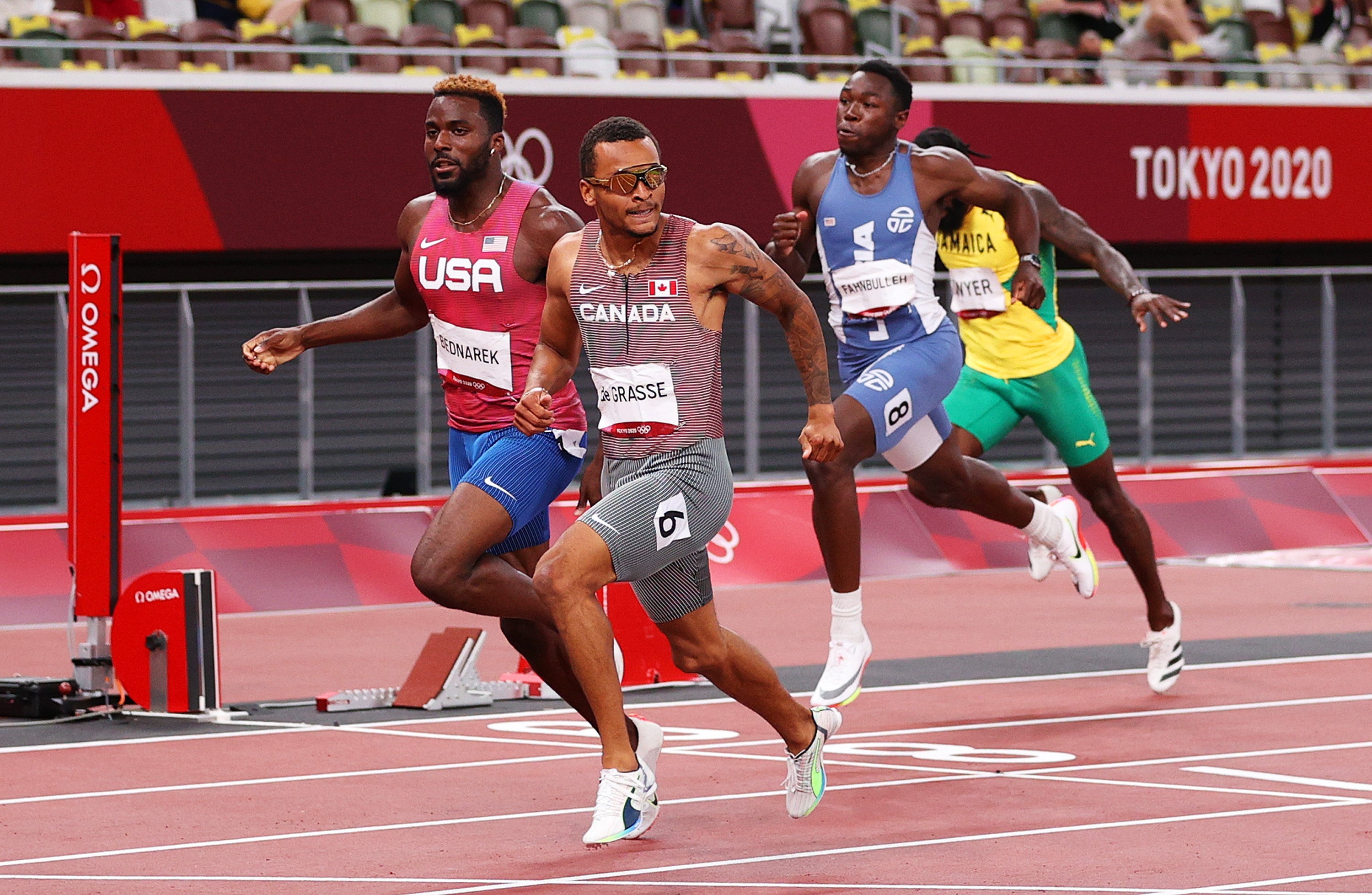 Andre de Grasse of Team Canada finishes ahead of Kenneth Bednarek of Team United States