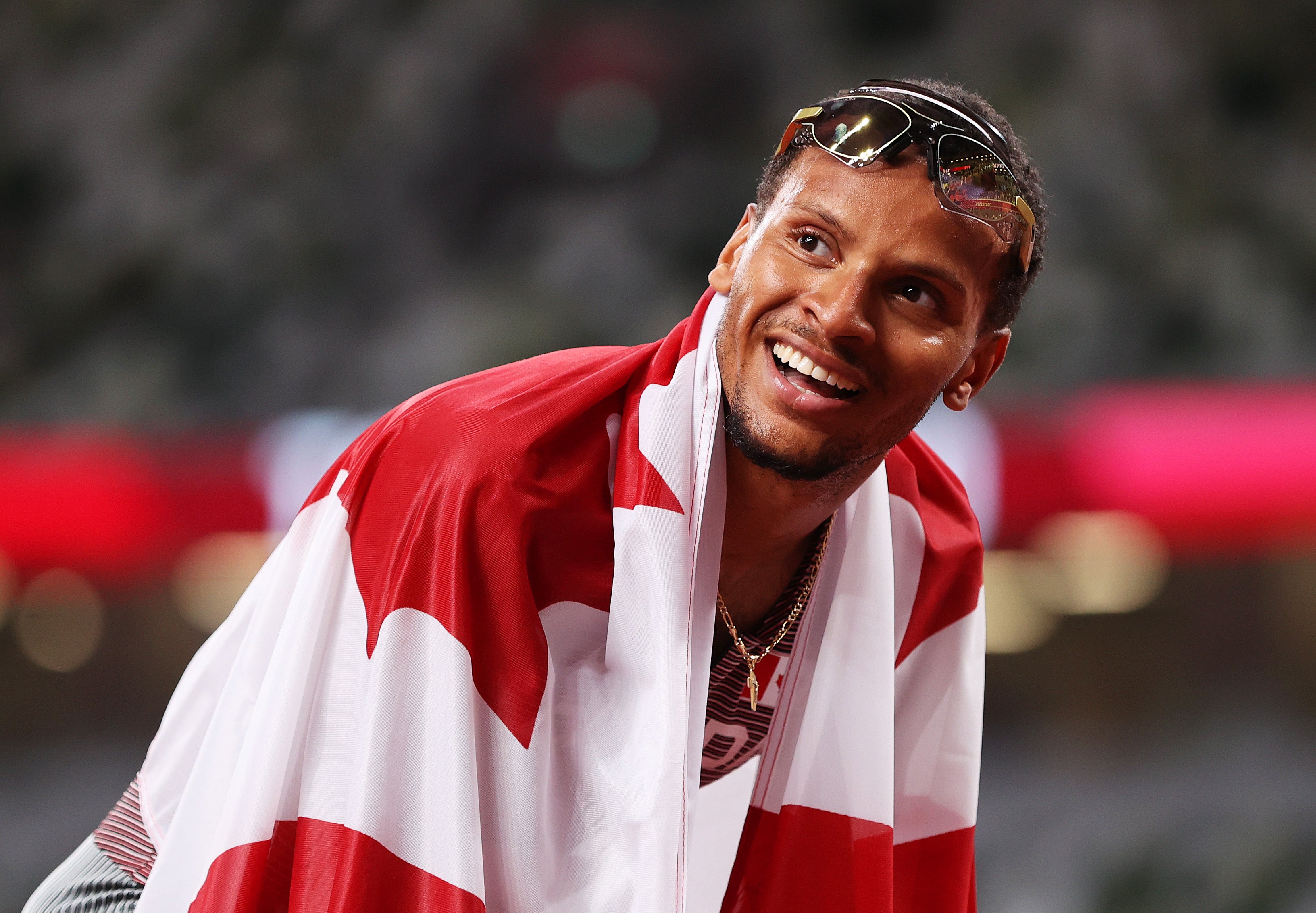 Andre De Grasse of Team Canada celebrates after winning the gold medal