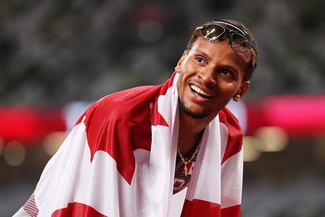 <p>Andre De Grasse of Team Canada celebrates after winning the gold medal</p>