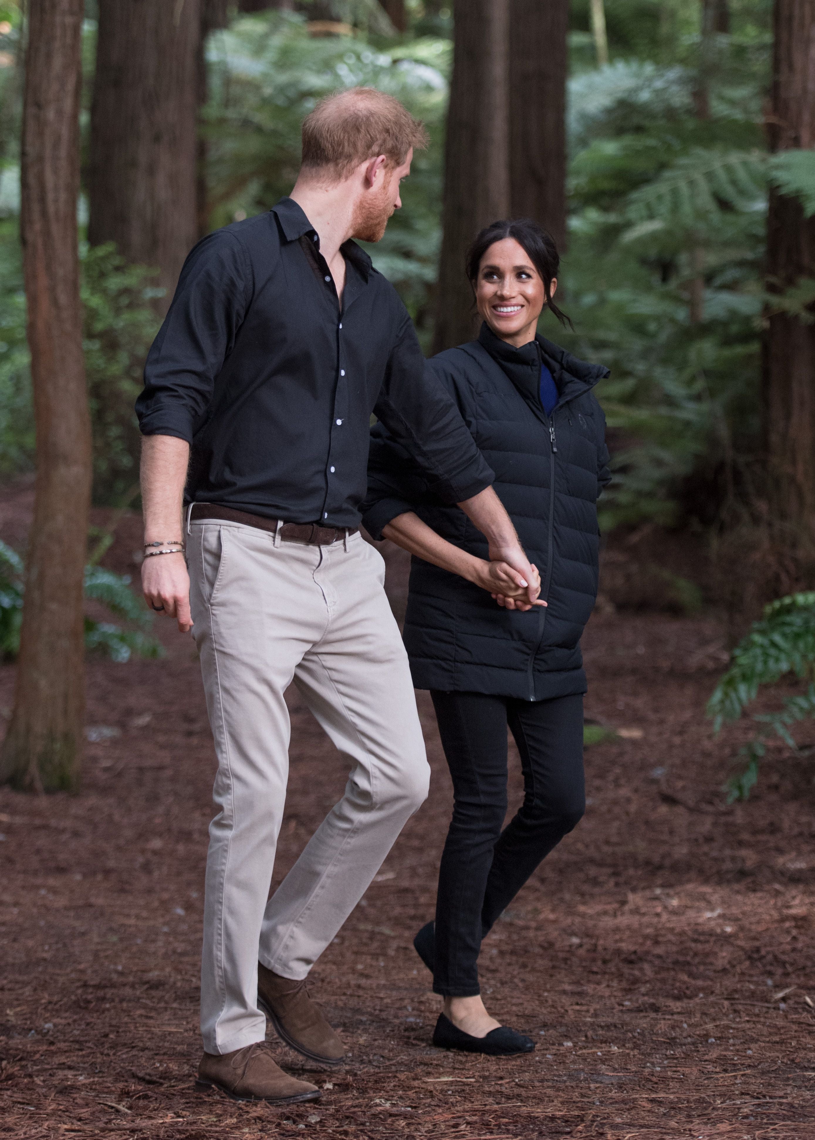 Prince Harry and Meghan Duchess of Sussex walk through the Redwoods Treewalk in Rotorua