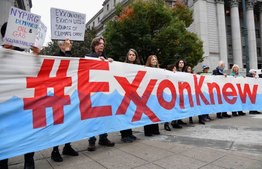 Climate activists protest on the first day of the Exxon Mobil trial outside the New York State Supreme Court in October 2019. New legislation has been introduced that would make fossil fuel corporations responsible for emissions they produce