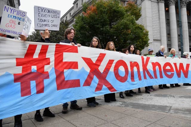 <p>Climate activists protest on the first day of the Exxon Mobil trial outside the New York State Supreme Court in October 2019. New legislation has been introduced that would make fossil fuel corporations responsible for emissions they produce</p>