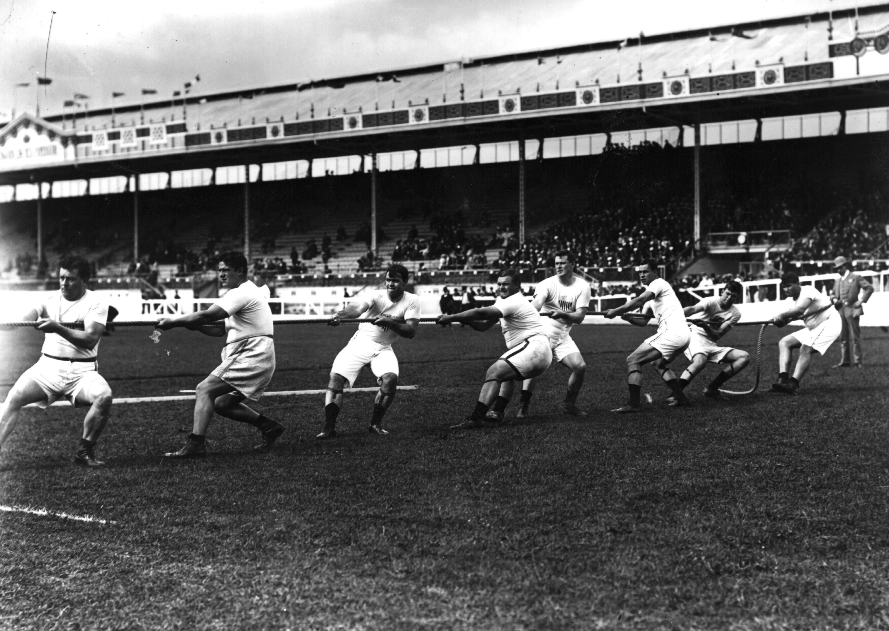 July 1908: The Unites States tug-of-war team in action during the 1908 London Olympics at White City Stadium.