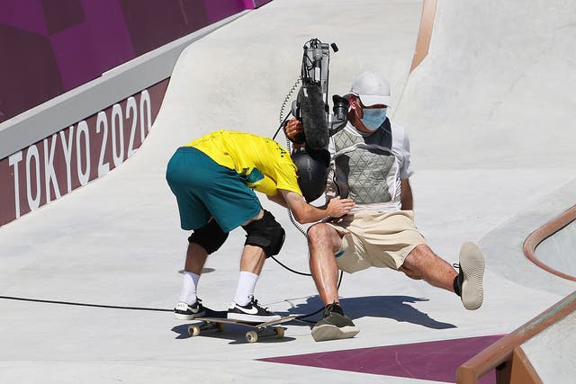 <p>Kieran Woolley of Team Australia crashes into a TV Cameraman during the Men's Skateboarding Park Preliminary Heat 3 on day thirteen of the Tokyo 2020 Olympic Games at Ariake Urban Sports Park on August 05, 2021 in Tokyo, Japan</p>