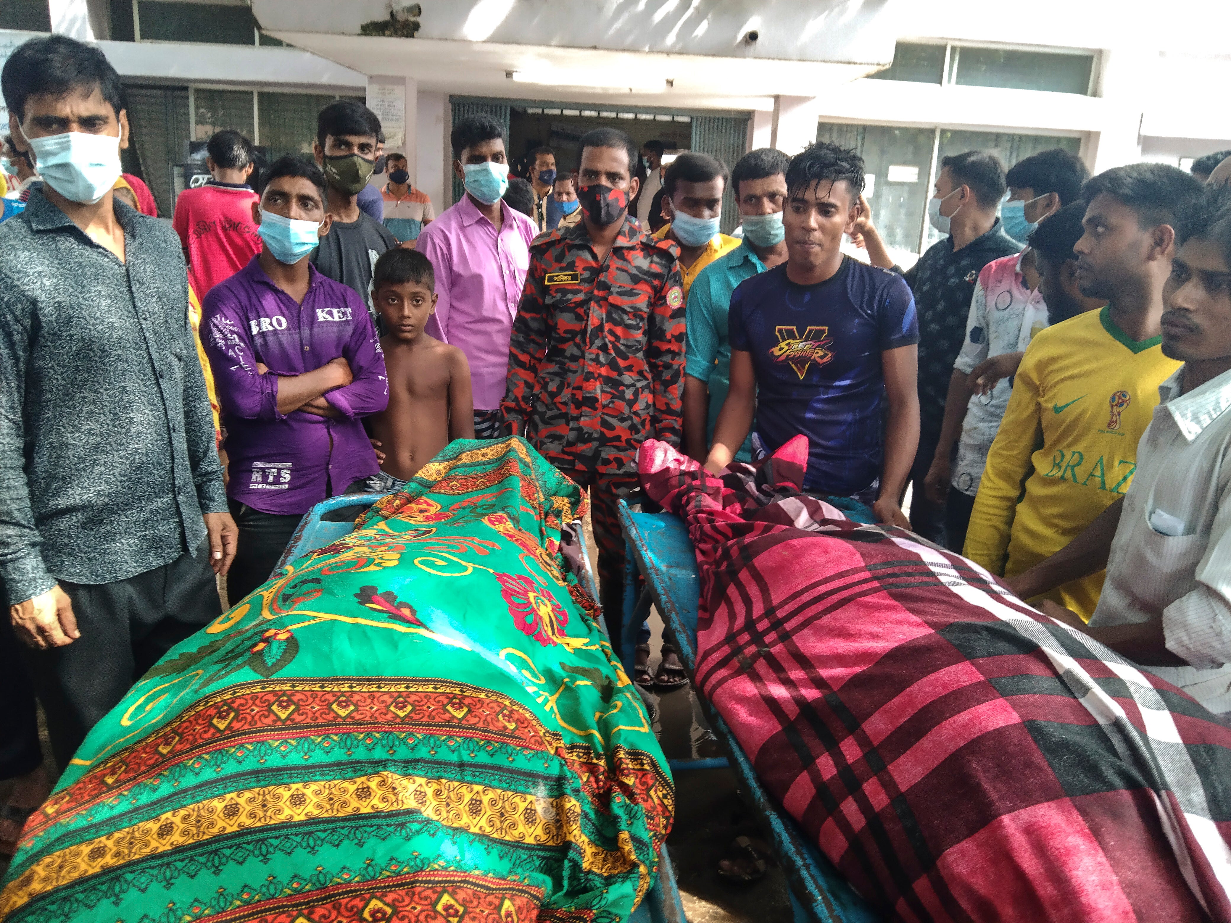 People gather around bodies of victims after lightning killed more than a dozen people in Shibganj town, about 245 kilometres northwest of Dhaka, Bangladesh on 4 August 2021
