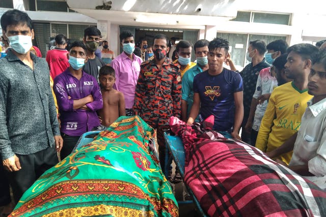<p>People gather around bodies of victims after lightning killed more than a dozen people in Shibganj town, about 245 kilometres northwest of Dhaka, Bangladesh on 4 August 2021</p>