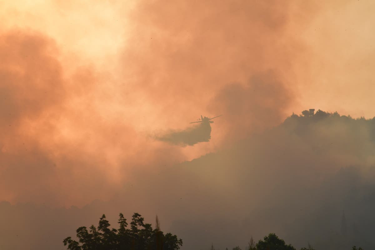 Greece and Turkey fires &ndash; live: Evacuations underway, Olympia saved and monks refuse to leave burning island
