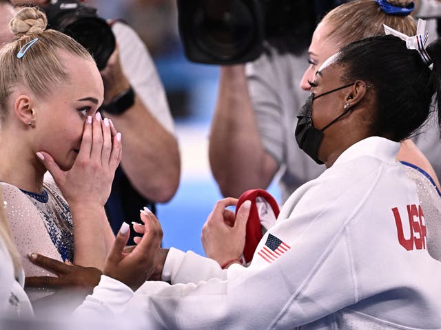 <p>Simone Biles congratulates Russia’s Angelina Melnikova on her Olympics win</p>