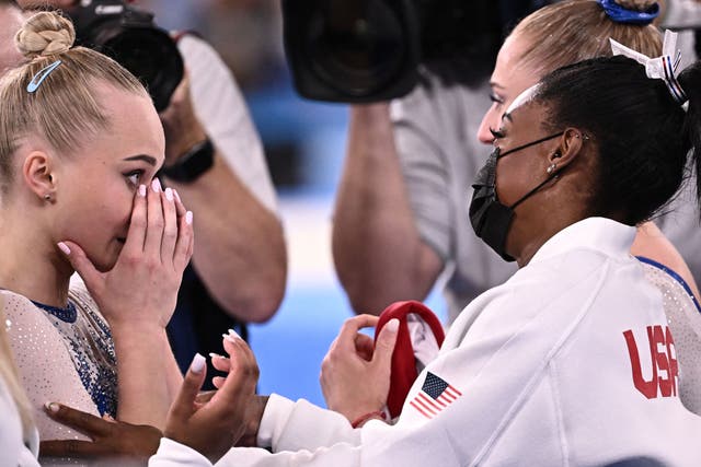 <p>Simone Biles congratulates Russia’s Angelina Melnikova on her Olympics win</p>