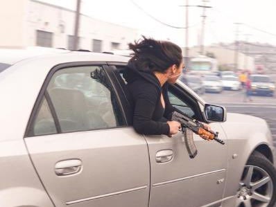 Police revealed that a woman leaned out of a Cadi holding an AK47 in a statement on Thursday
