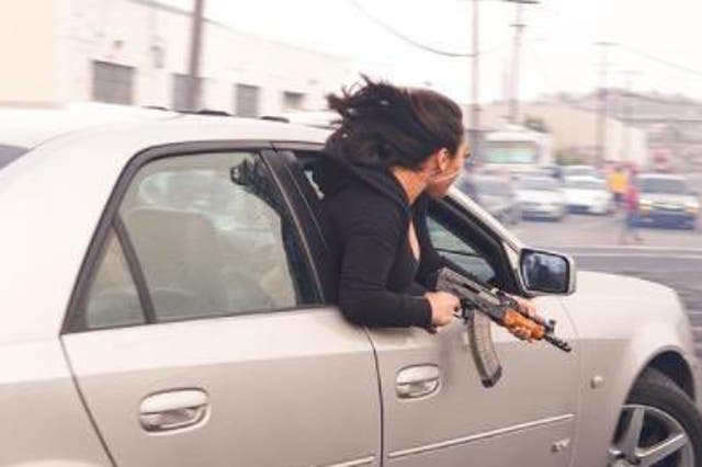 <p>Police revealed that a woman leaned out of a Cadi holding an AK47 in a statement on Thursday</p>