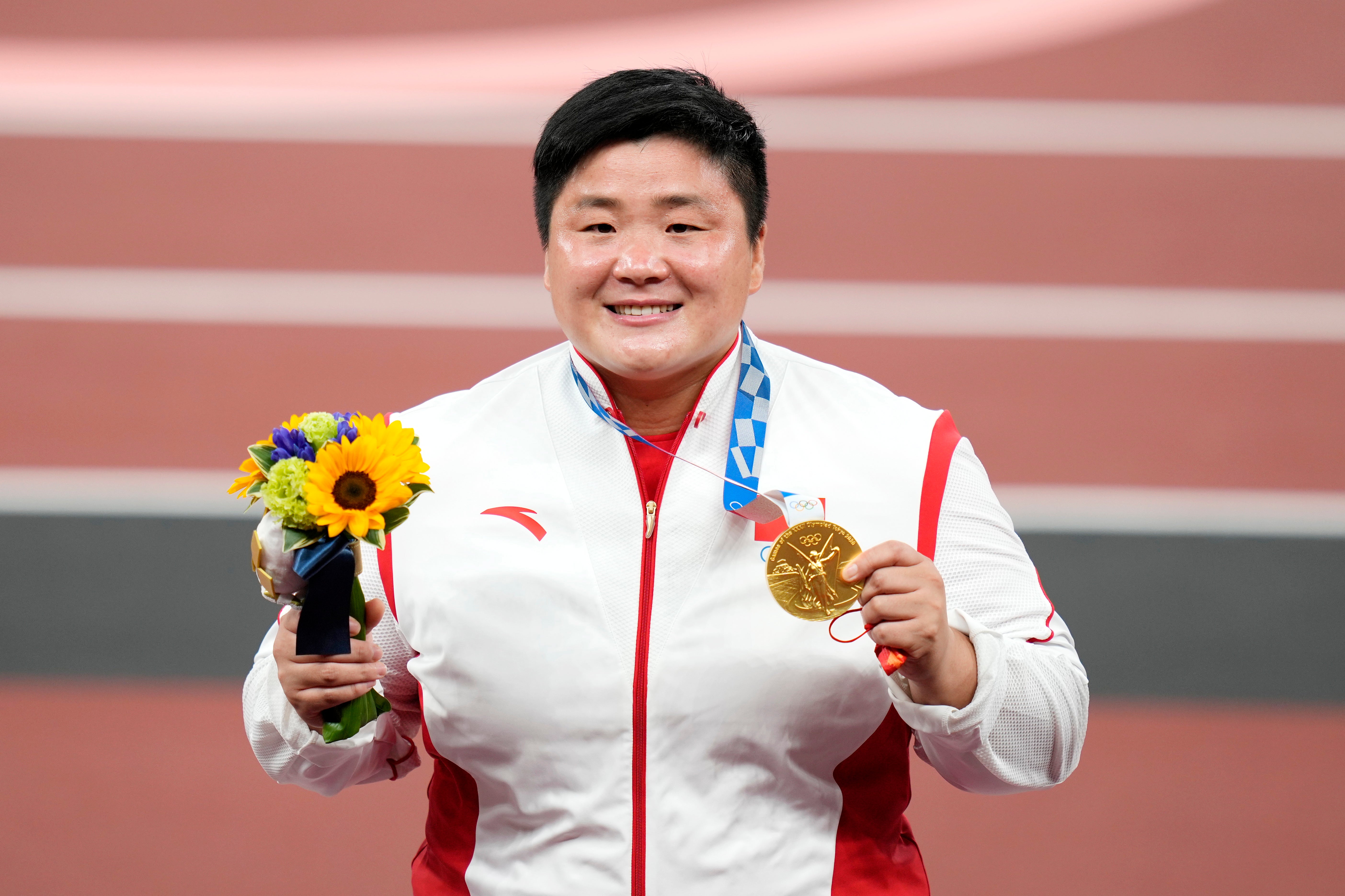Gold medalist Lijiao Gong of China is seen during the medal ceremony for the women's shot put during the athletics events of the Tokyo 2020 Olympic Games at the Olympic Stadium in Tokyo, Japan, 1 August 2021