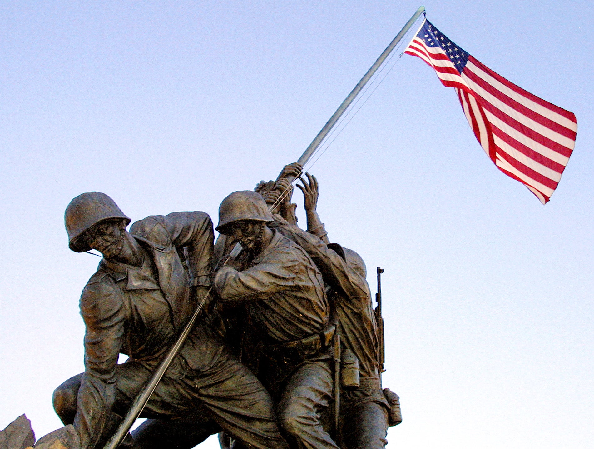The American flag flies over the US Marine Memorial in Arlington depicting the flag raising at Iwo Jima during the Second World War