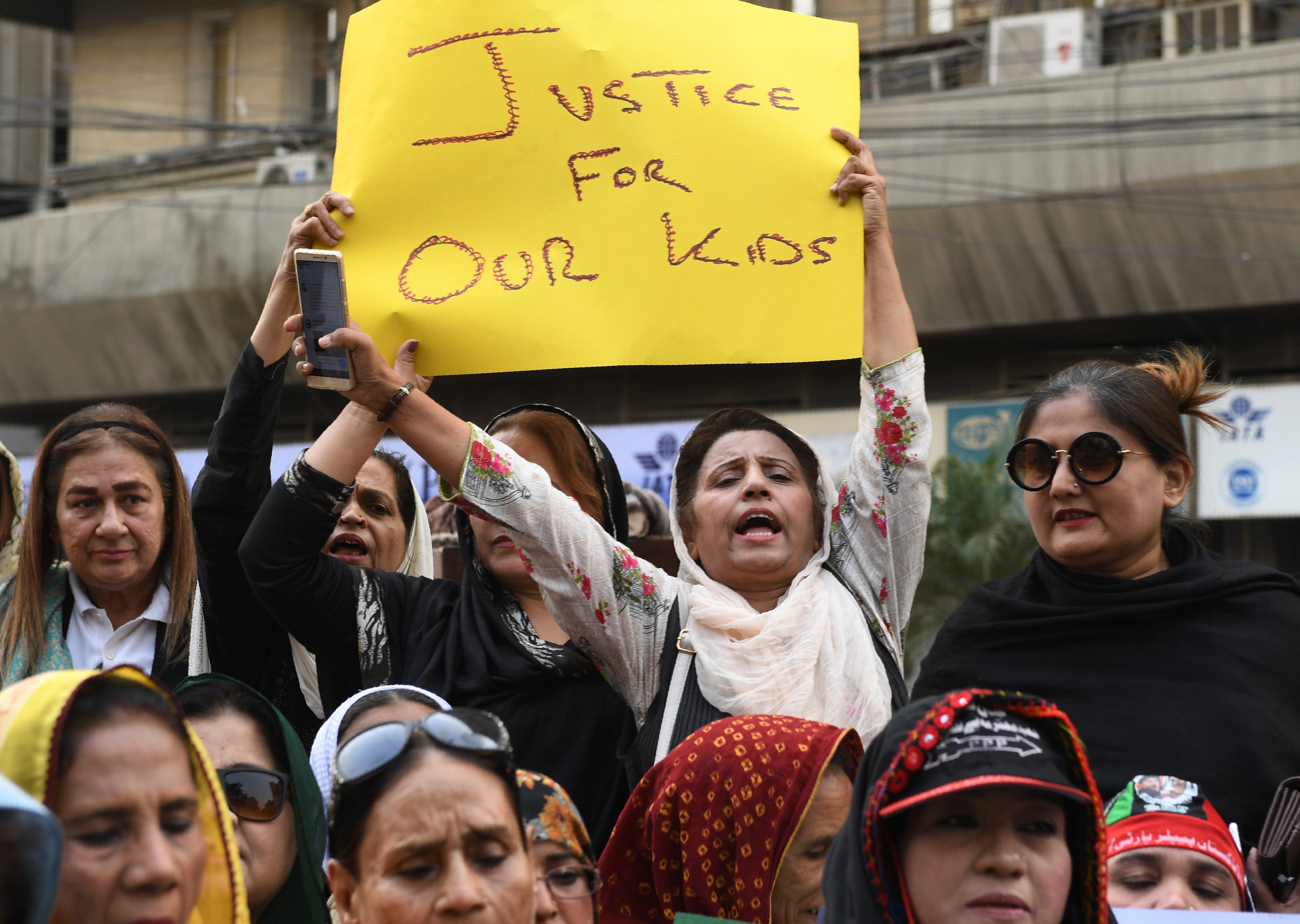 FILE: Pakistani civil society activists take part in a protest after a child was raped and murdered in Karachi on 12 January 2018. Three men have been arrested in Pakistan for forcibly making a child lick a hot axe in order to prove his innocence in a theft case