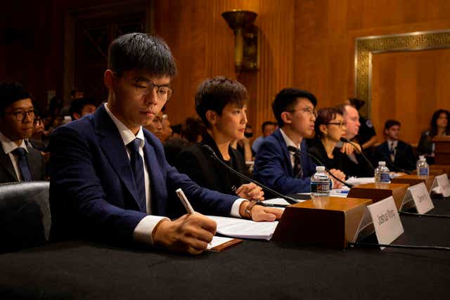 <p>Hong Kong pro-democracy activists at a Congress office on Capitol Hill</p>