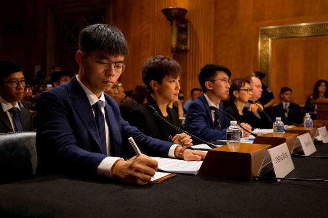 <p>Hong Kong pro-democracy activists at a Congress office on Capitol Hill</p>
