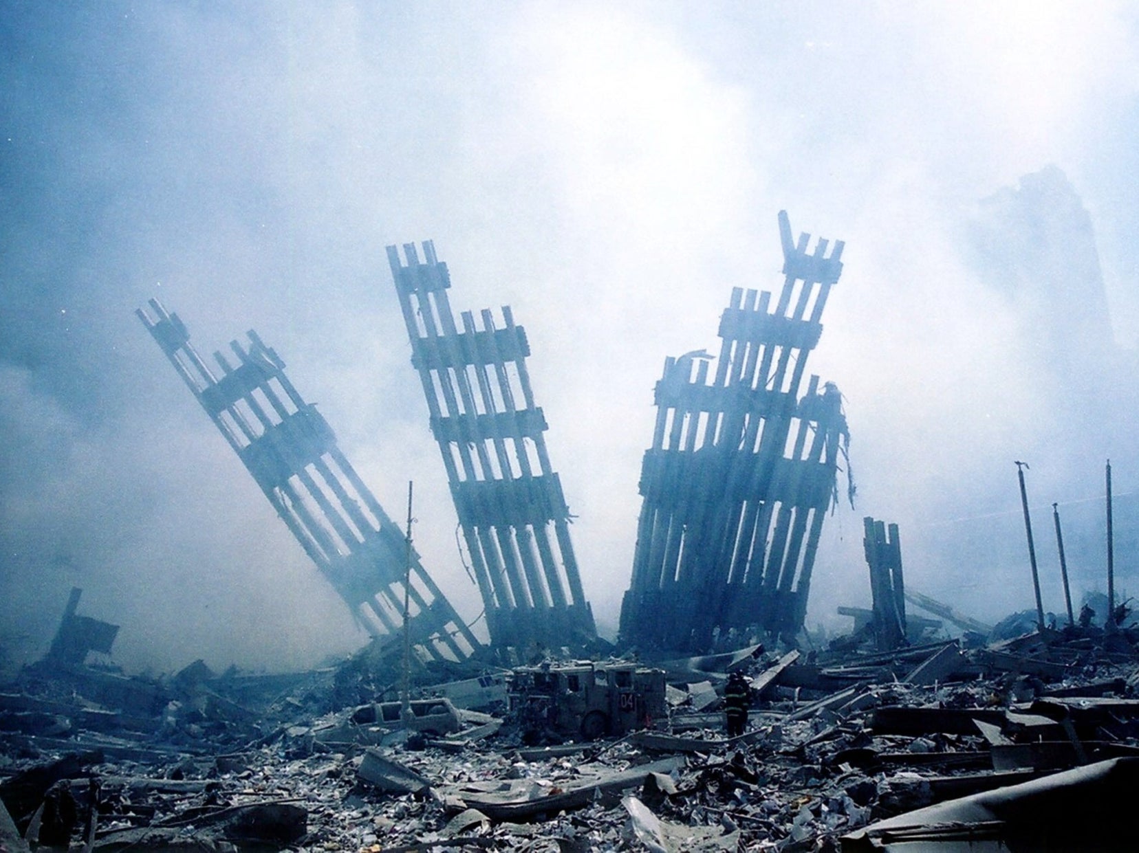Rubble smolders at the wreckage of the World Trade Center on 11 September, 2001