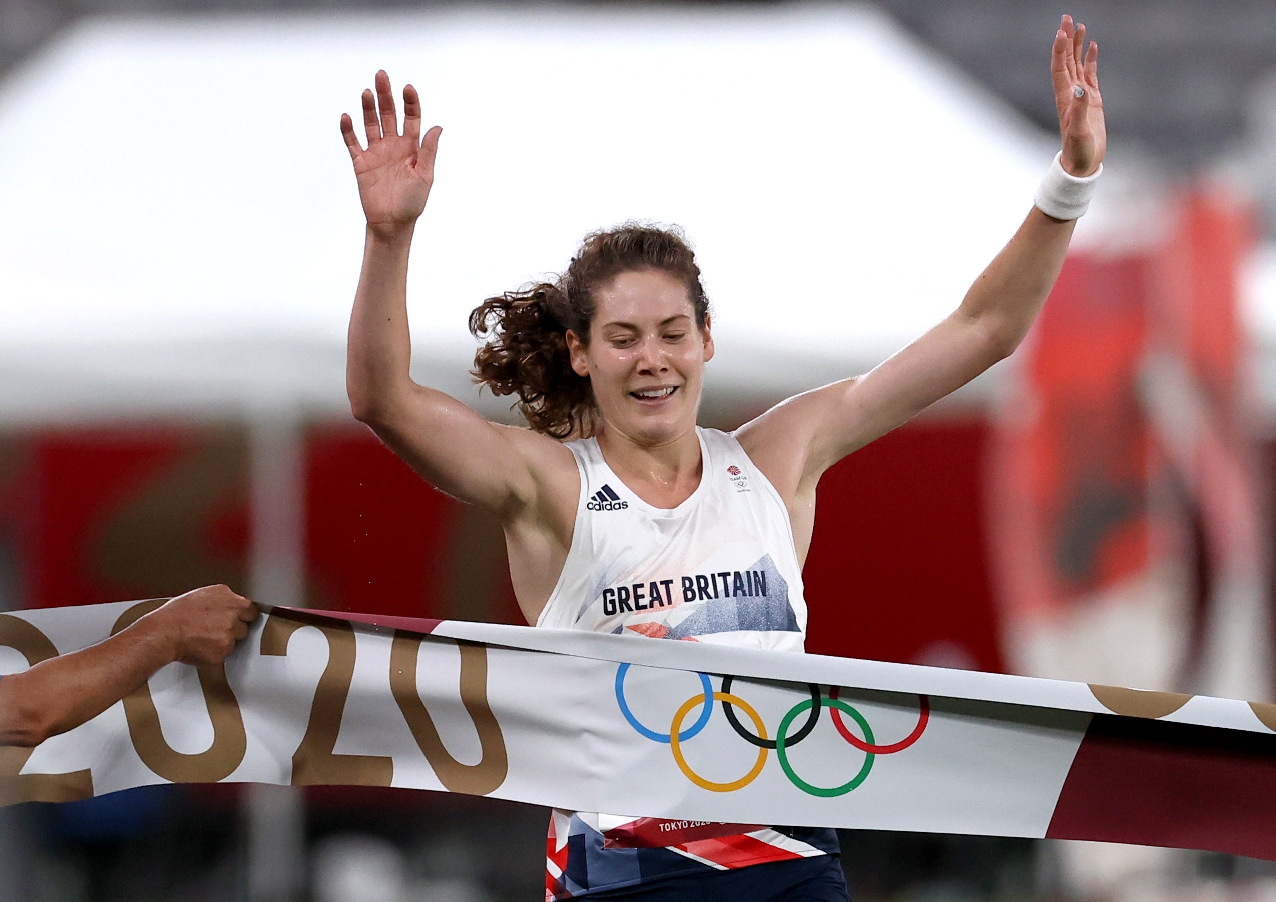 Kate French crosses the line to win gold
