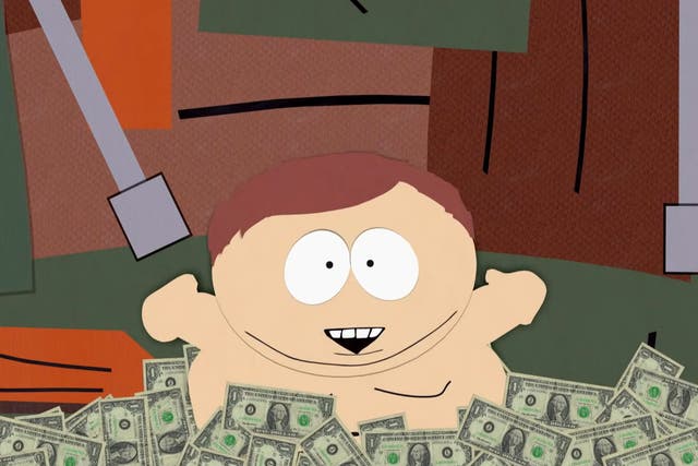 <p>Eric Cartman sits in a bed of money in an episode of ‘South Park'</p>