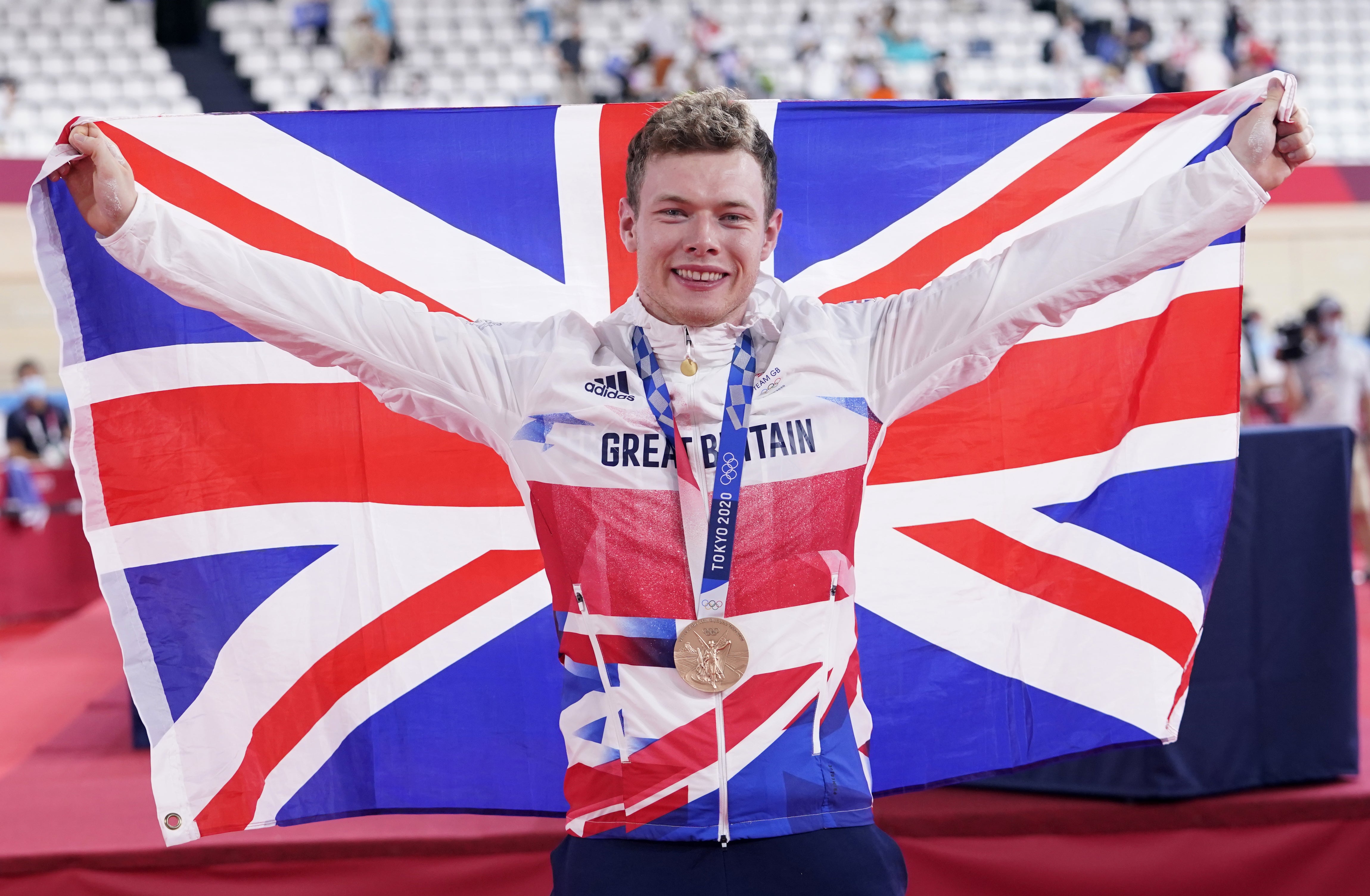 Carlin celebrated with his bronze medal at the Izu velodrome (Danny Lawson/PA)