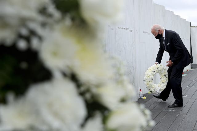 <p>Democratic presidential nominee and former Vice President Joe Biden lays a wreath at the Flight 93 National Memorial on the 19th anniversary of the 9/11 terror attacks 11 September 2020</p>