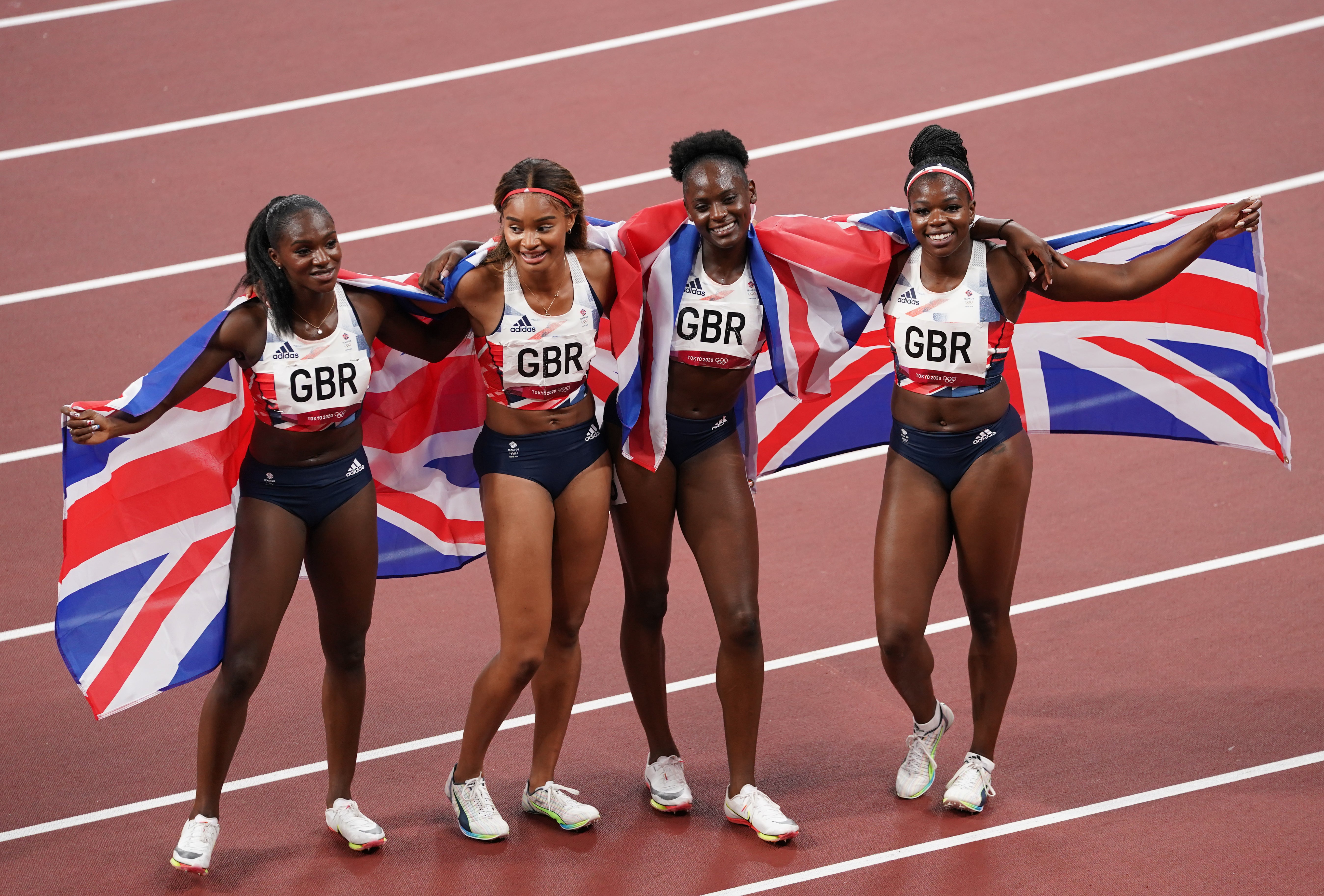 Great Britain’s Dina Asher-Smith Imani Lansiquot, Daryll Neita, and Asha Philip after winning the bronze medal in the women’s 4 x 100m relay.