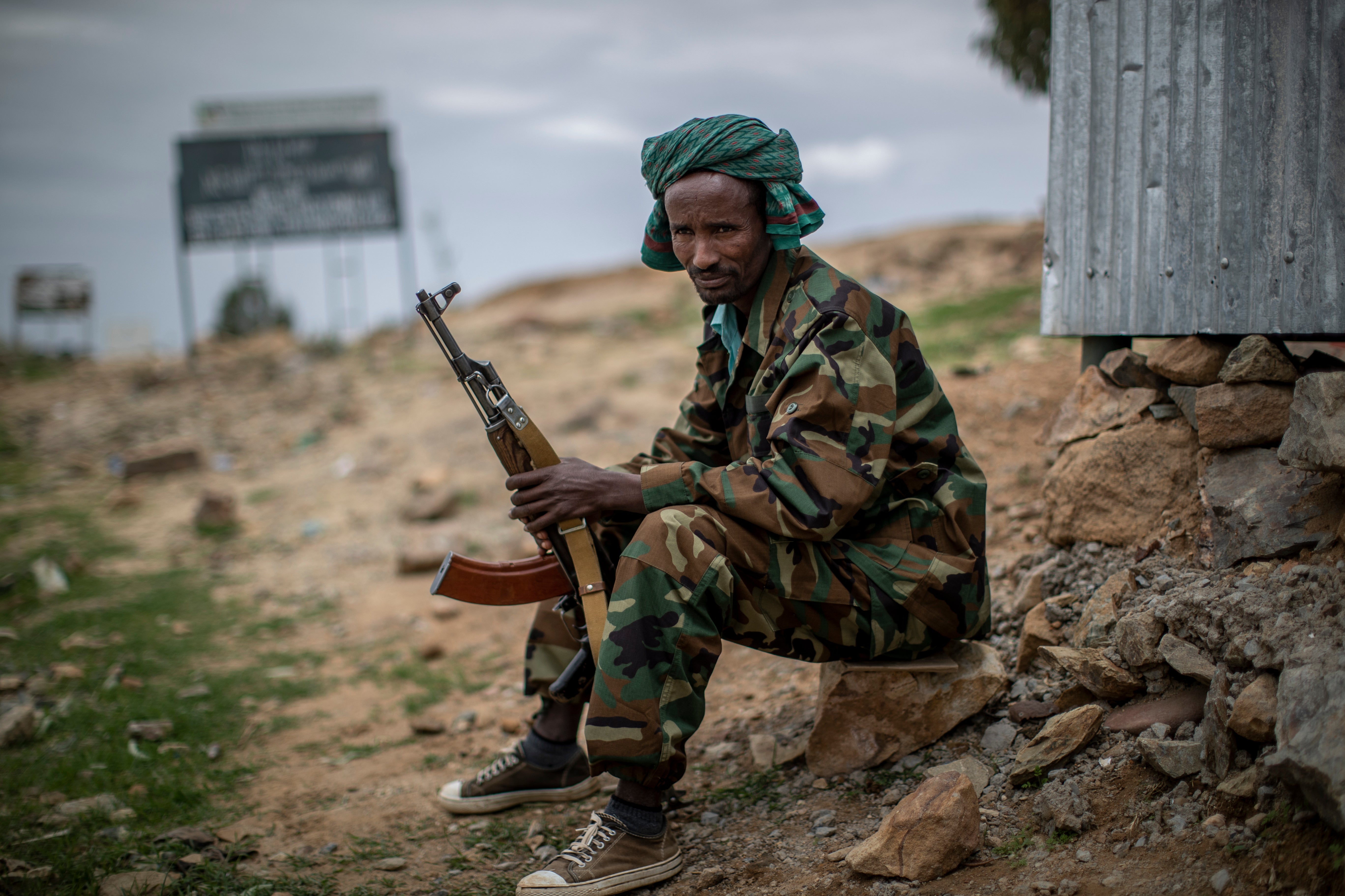A fighter loyal to the Tigray People's Liberation Front (TPLF) mans a guard post on the outskirts of the town of Hawzen