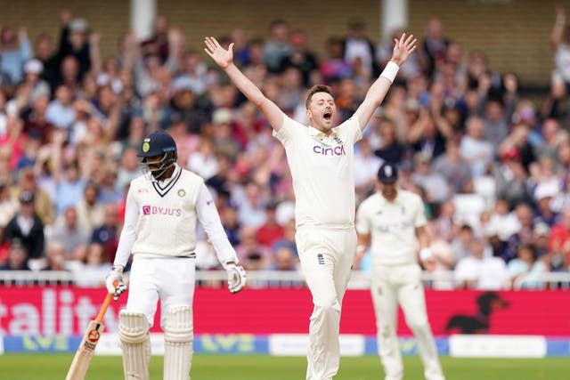 <p>Ollie Robinson celebrates after taking the wicket of Jasprit Bumrah</p>