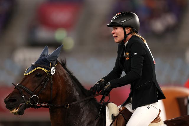 <p>Annika Schleu of Team Germany looks dejected following her run in the Riding Show Jumping of the Women's Modern Pentathlon on day fourteen of the Tokyo 2020 Olympic Games at Tokyo Stadium on August 06, 2021 in Chofu, Japan</p>