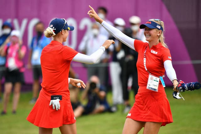 <p>USA's Nelly Korda (L) is congratulated by her sister USA's Jessica Korda (R) after winning the gold medal in round 4 of the women’s golf individual stroke play during the Tokyo 2020 Olympic Games at the Kasumigaseki Country Club in Kawagoe on August 7 2021</p>