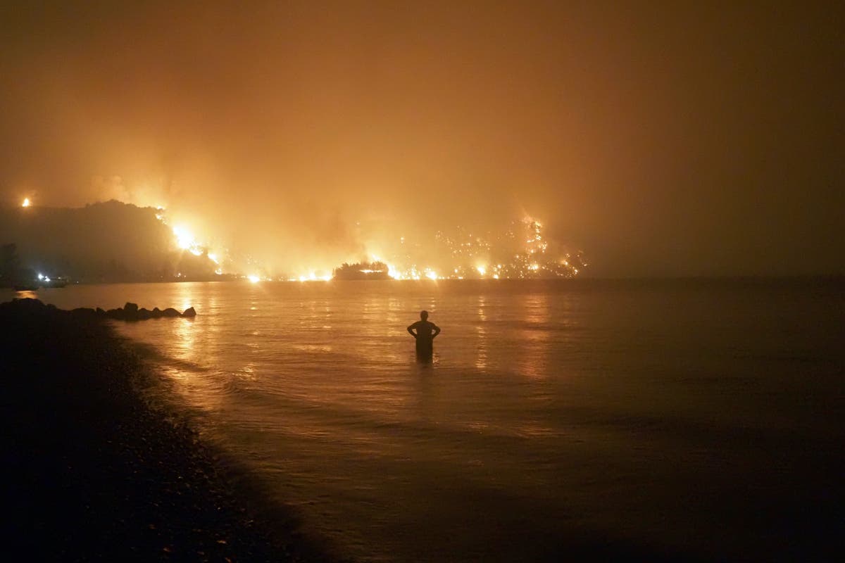 Fires rampage through forests in Greece, thousands evacuated