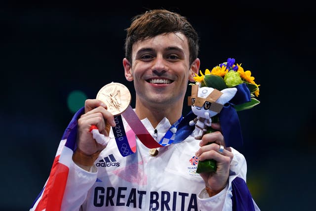 <p>Tom Daley poses with his bronze medal</p>
