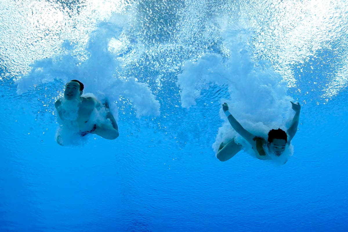 EXPLAINER: Olympic photos from far above &mdash; and underwater