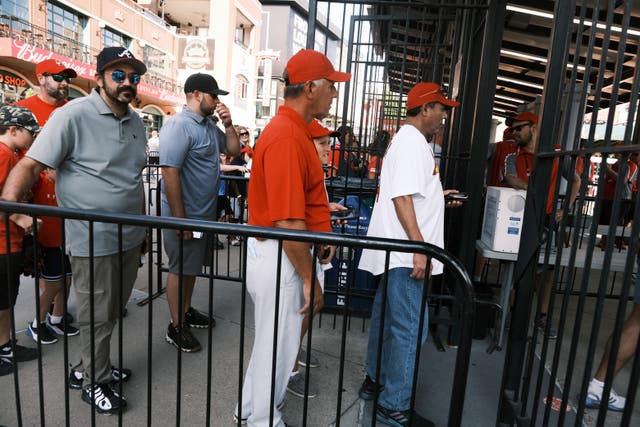 <p>Residents of St Louis, Missouri, queue to enter Cardinals game on August 3</p>