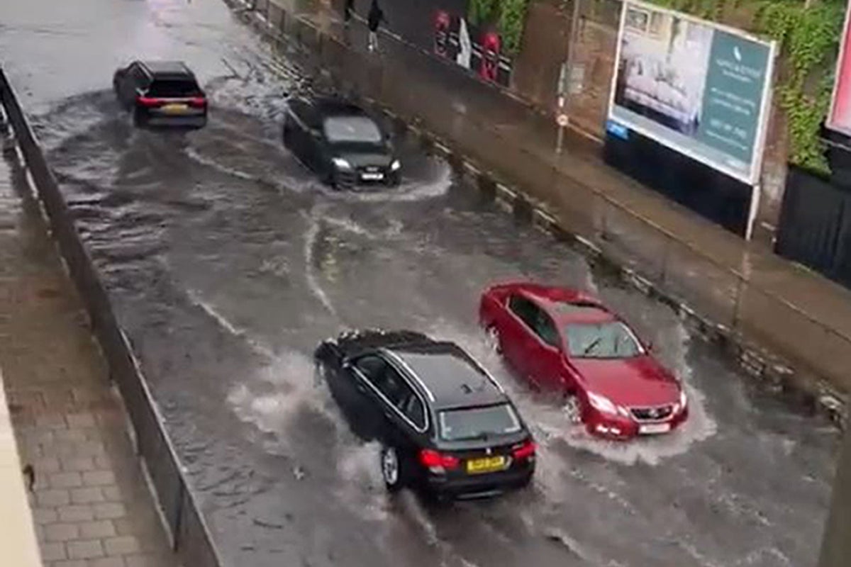 London floods: Streets submerged again as torrential rain triggers more ...
