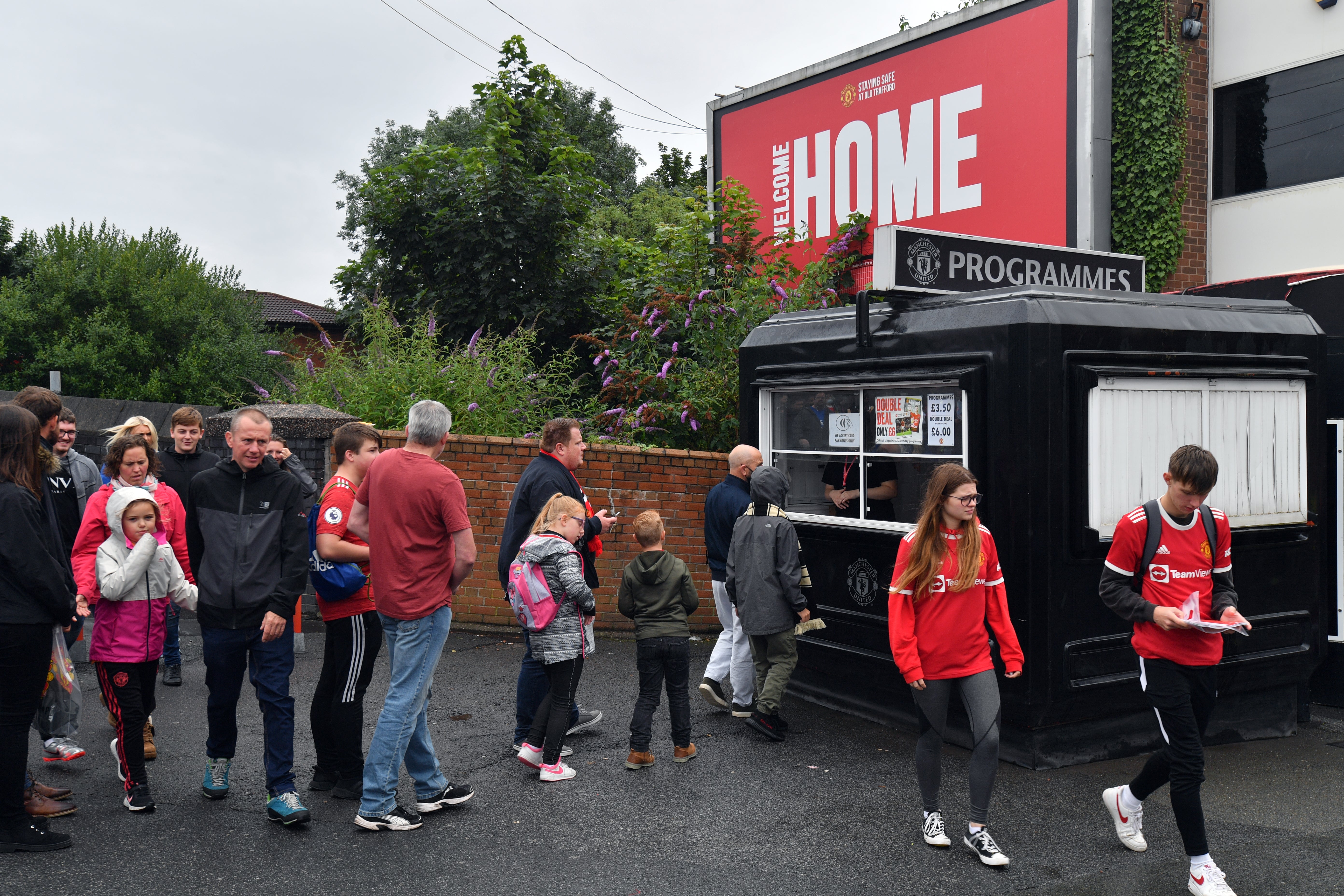 Fans purchase programmes at Old Trafford ahead of Manchester United’s friendly against Everton (Anthony Devlin/PA).