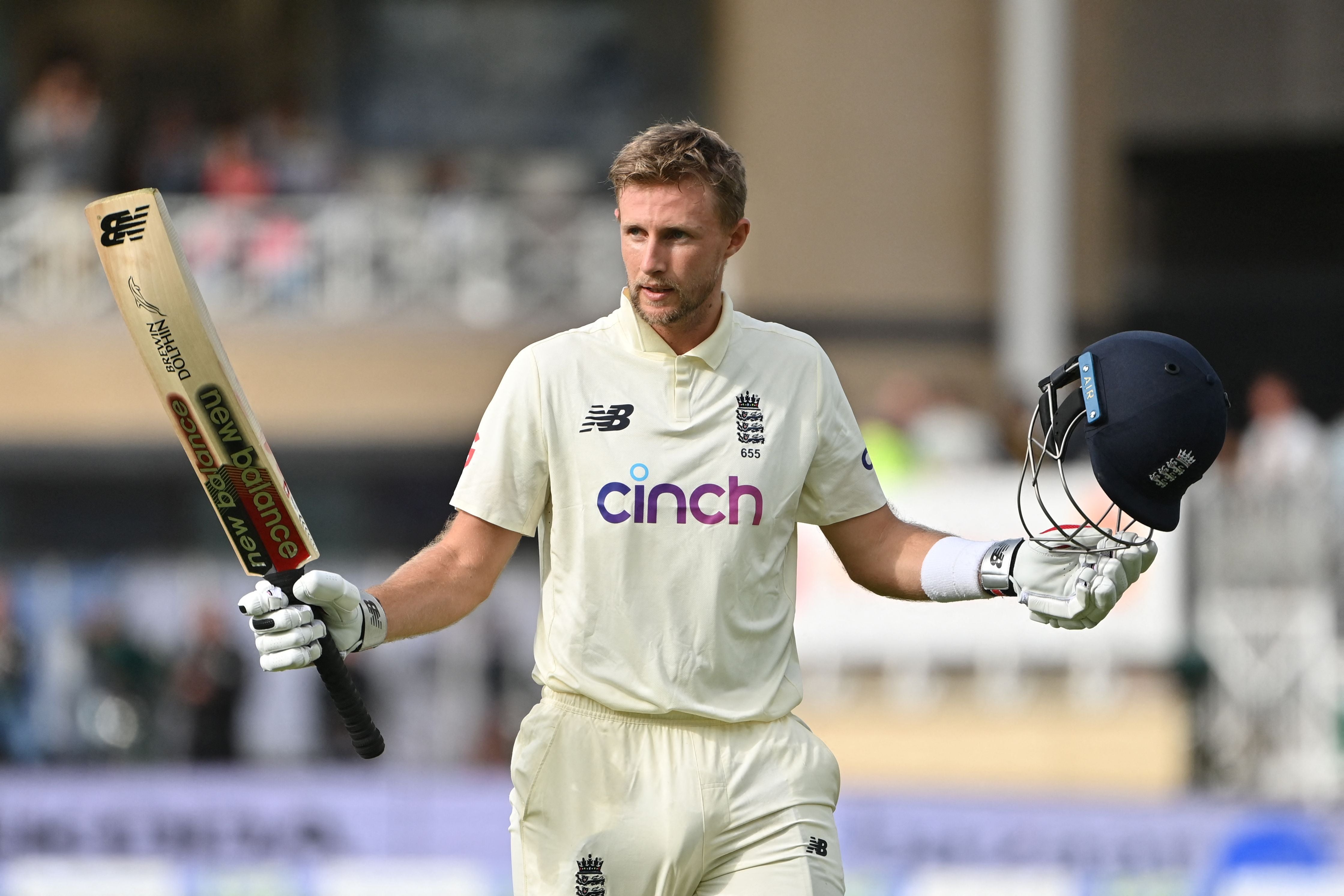 England’s captain Joe Root celebrates a century against India