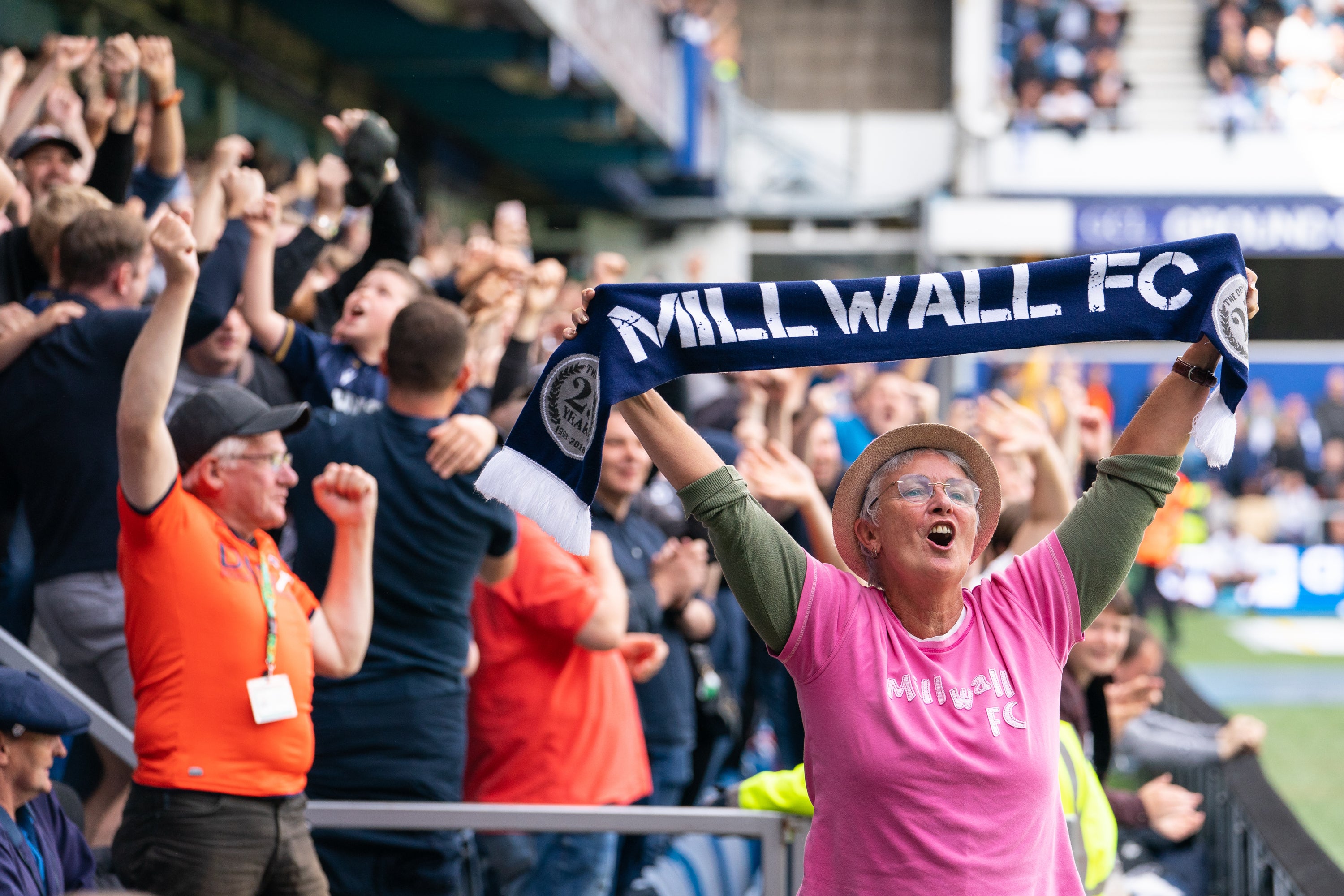 Millwall fans celebrate Jed Wallace’s early goal in the 1-1 draw against QPR at the Kiyan Prince Foundation Stadium (Dominic Lipinski/PA).