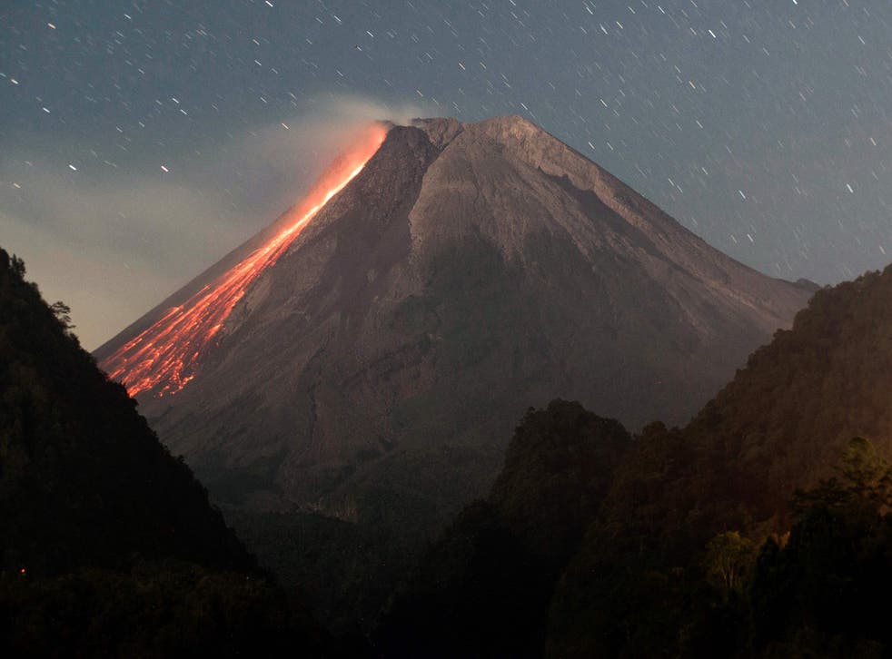 <p>Lava flows down Mount Merapi, Indonesia’s most active volcano, as seen from Sleman in Yogyakarta on 18 July</p>