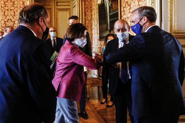 <p>Dominic Raab elbows with French Defence Minister Florence Parly as Foreign Minister Jean-Yves Le Drian and British Defence Secretary Ben Wallace look on before a meeting in Paris</p>