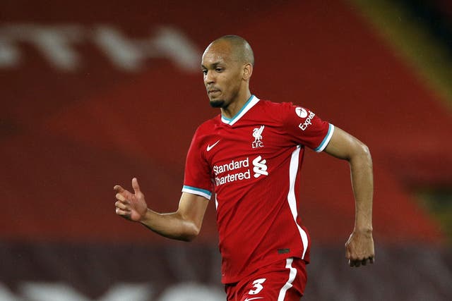 <p>Fabinho insists Liverpool are not worried about their big-spending rivals (Phil Noble/PA)</p>
