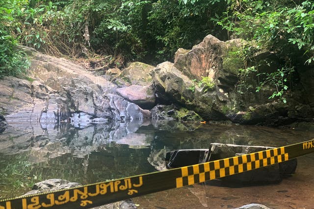 <p>Police tape cordons off the area where a woman was found dead at a secluded spot in Phuket</p>