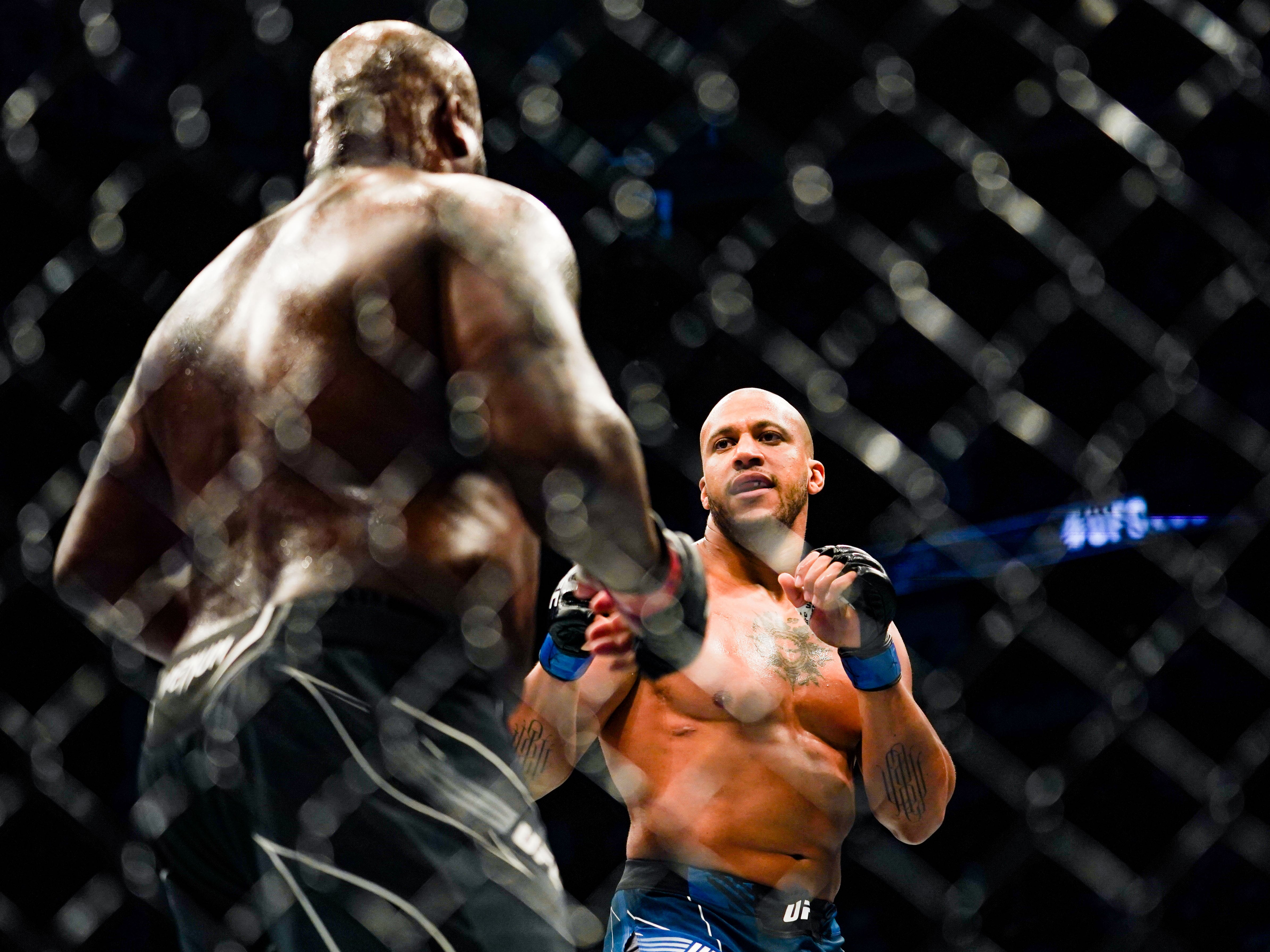 Ciryl Gane (right) finished Derrick Lewis in the third round